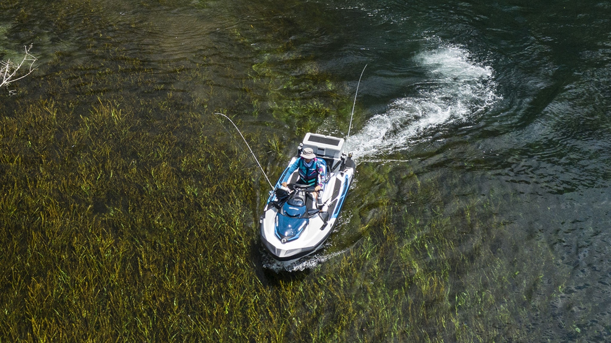 Woman riding a Sea-Doo Fish Pro in a river