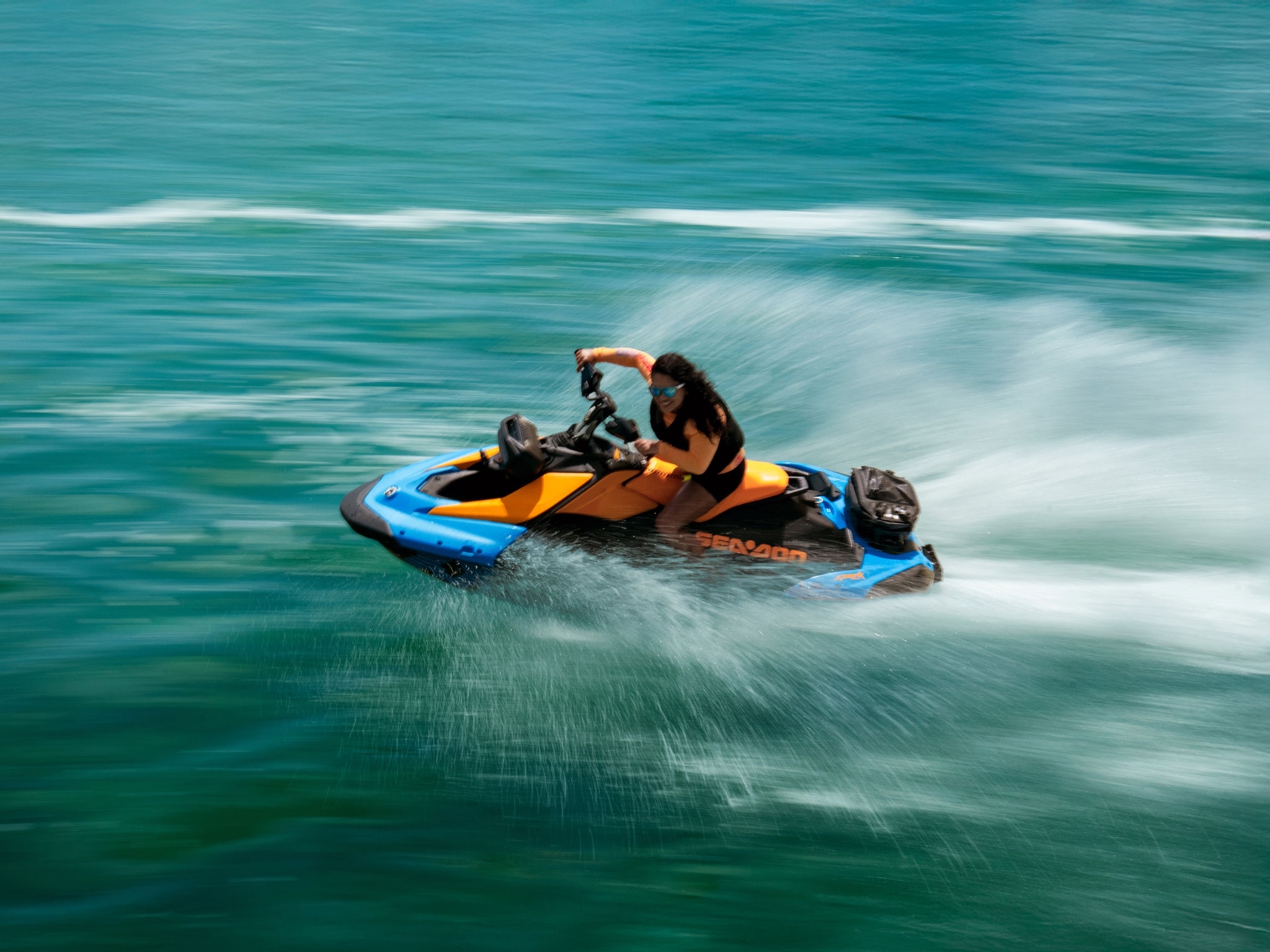 Woman riding a 2026 Sea-Doo Spark at high speed