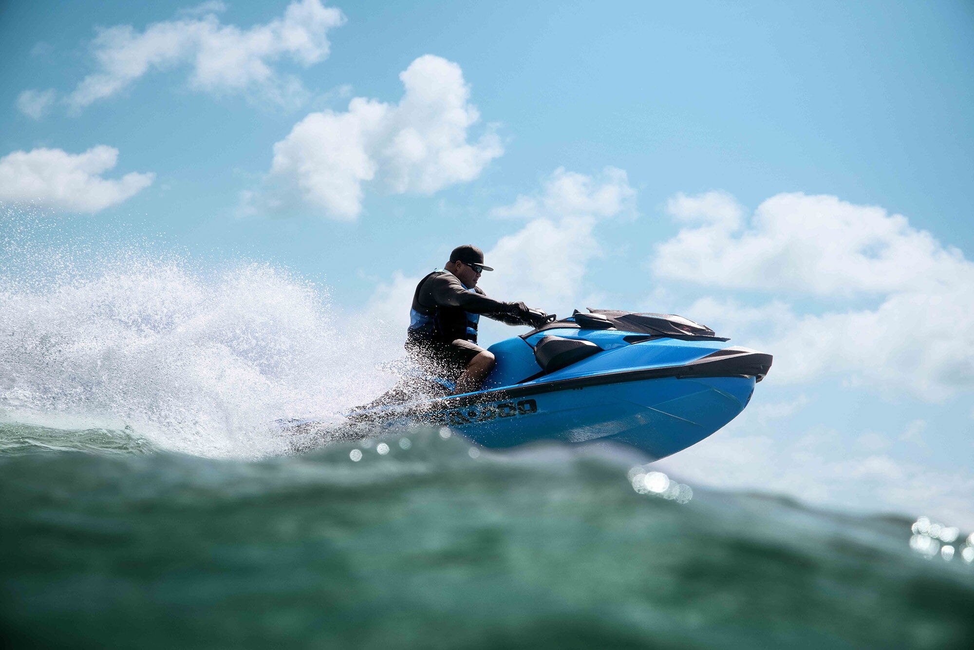 Man riding a 2026 Sea-Doo RXP-X personal watercraft