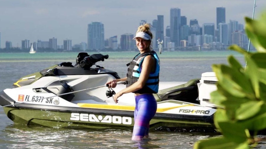 Bri Andrassy posing with a fish