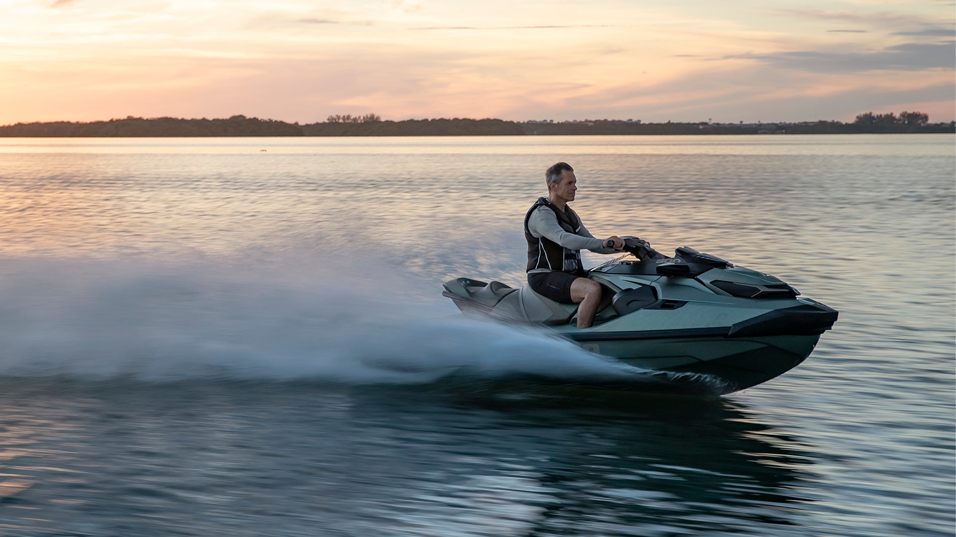 Rider driving a GTX limited personal watercraft from Sea-Doo