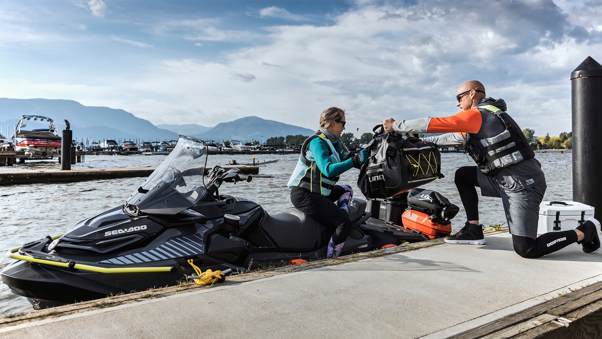 Two people loading up a Sea-Doo personal watercraft