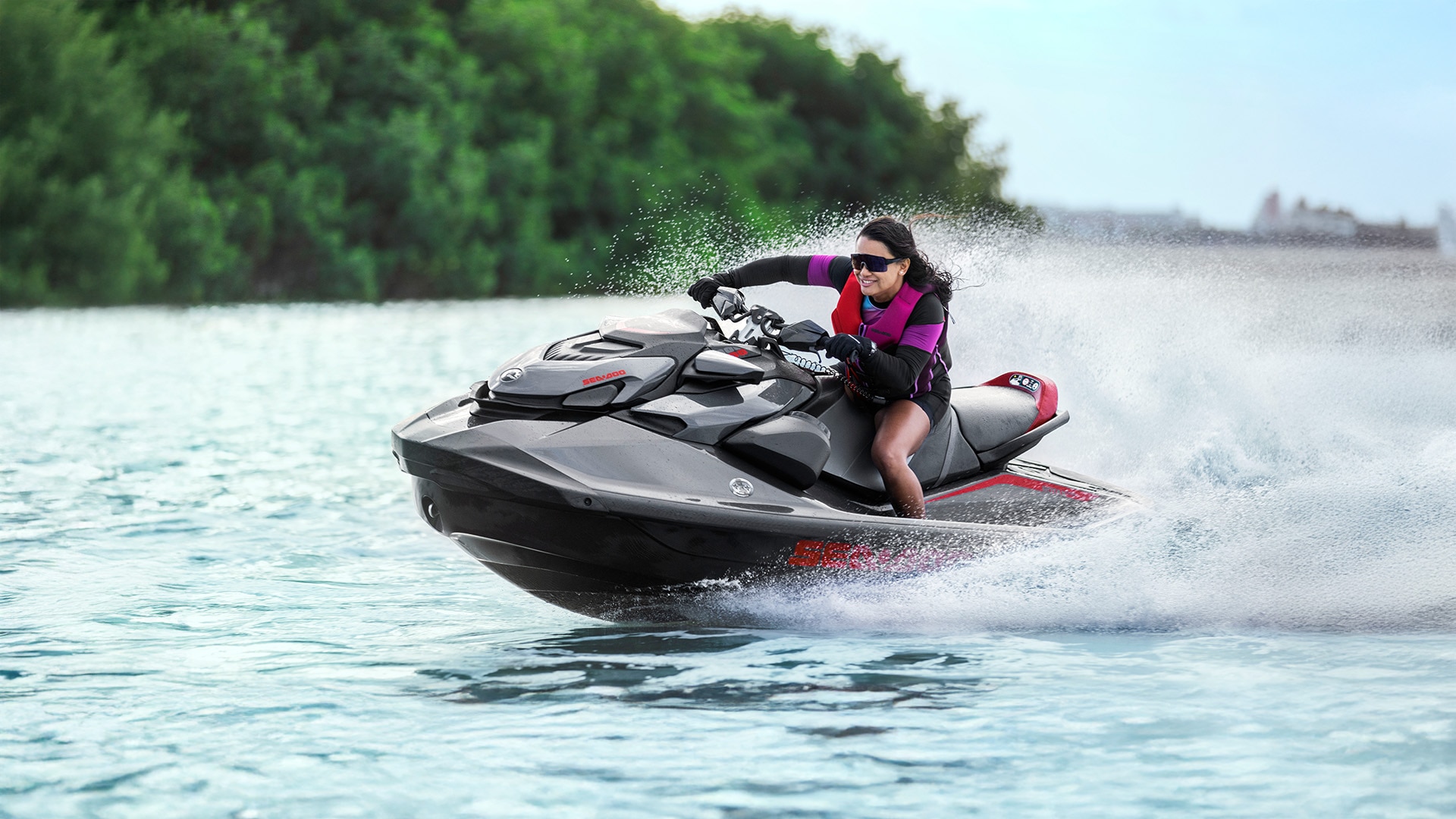 Woman riding at high speed on her Sea-Doo PWC