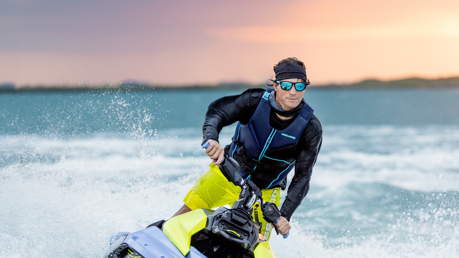 Rider in Sea-Doo PFD riding the waves