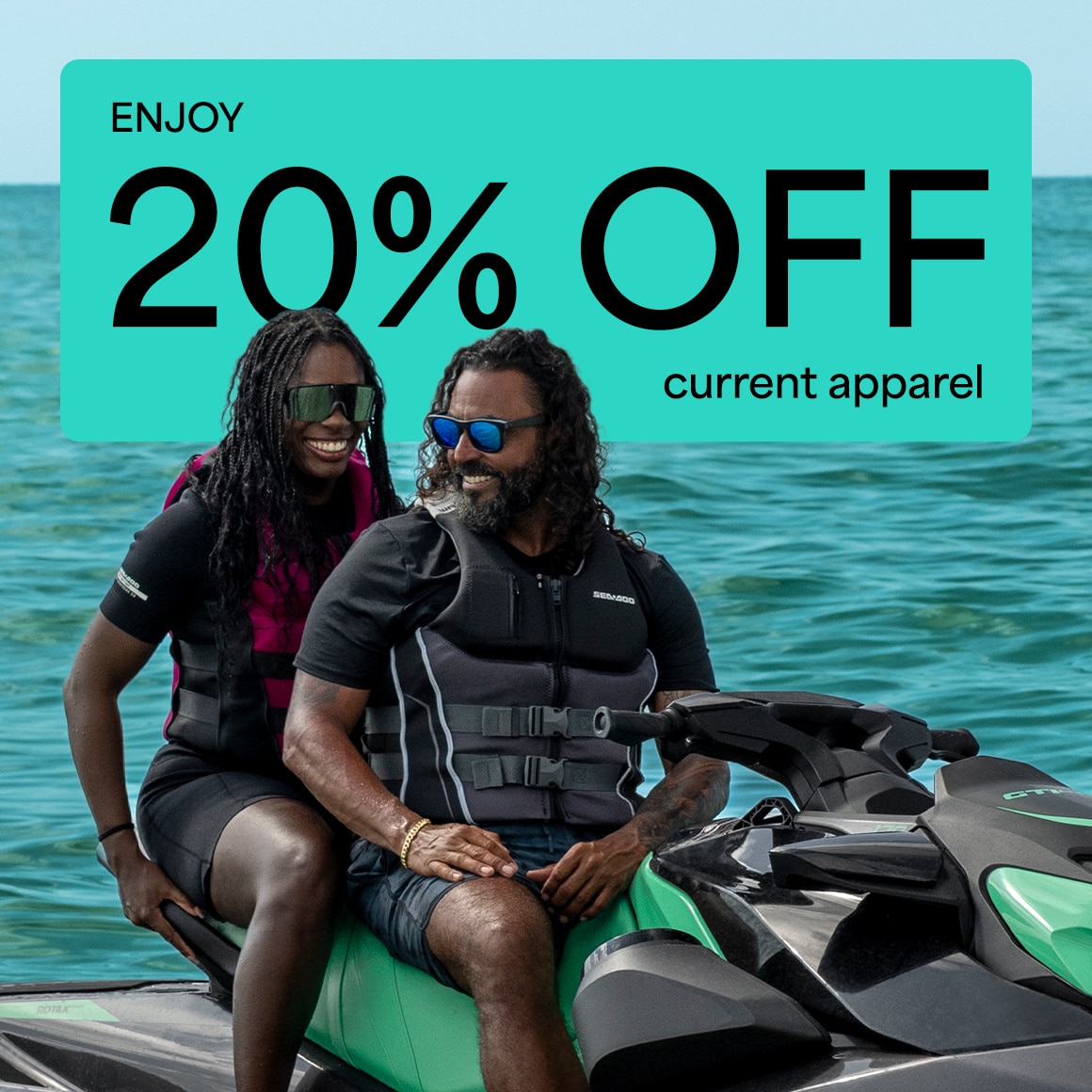 Two riders smiling on a sea-doo GTR