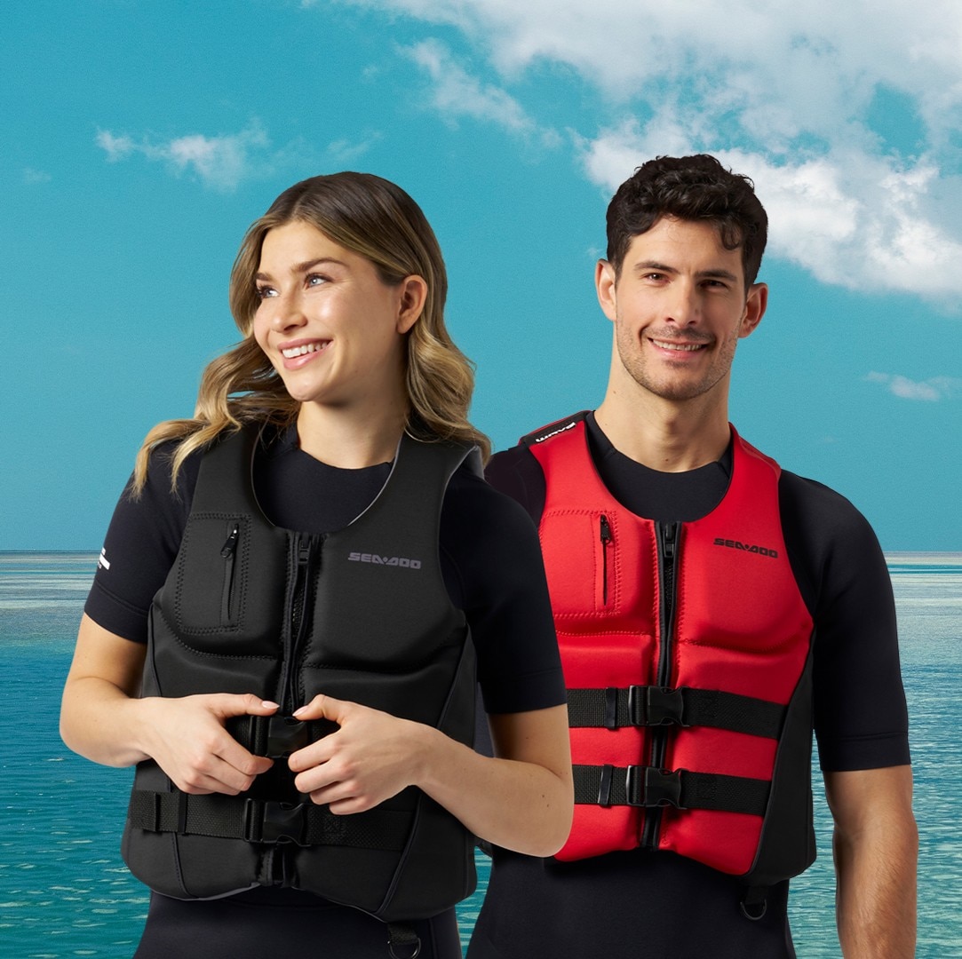 A man and a woman wearing their Sea-Doo personal flotation devices