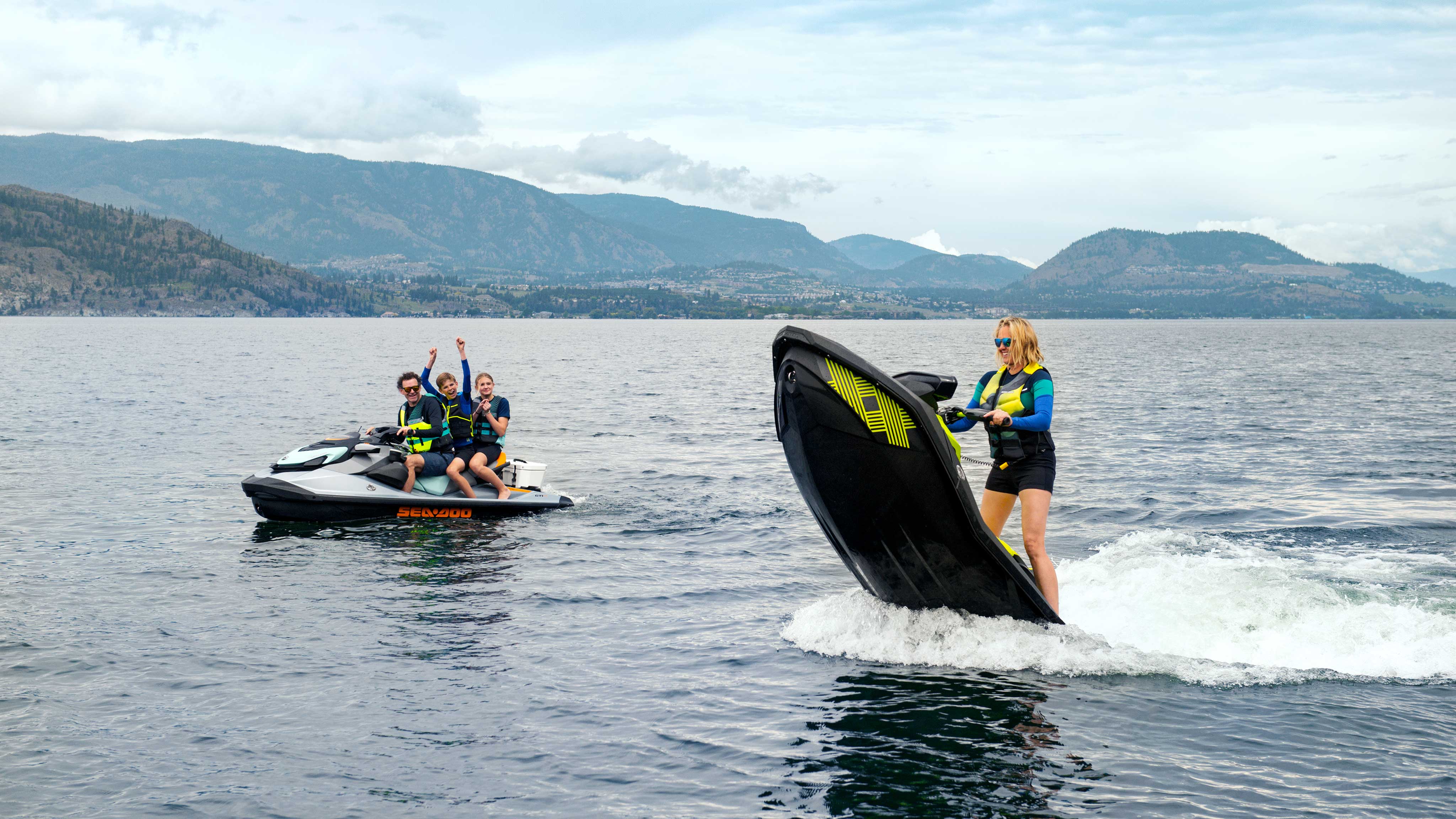 Family out riding Sea-Doo personal watercrafts