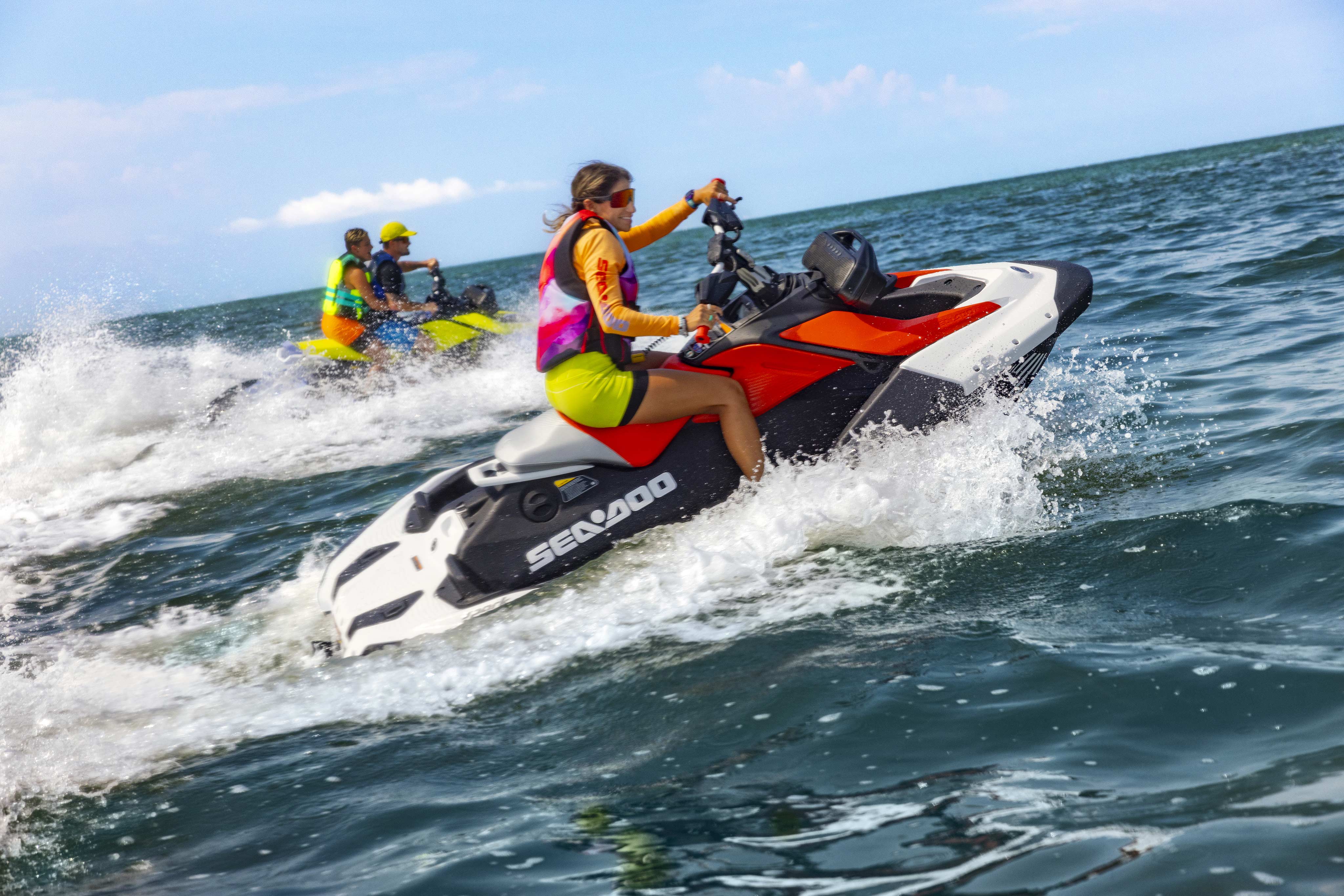 Two Sea-Doo Spark personal watercraft riding on water