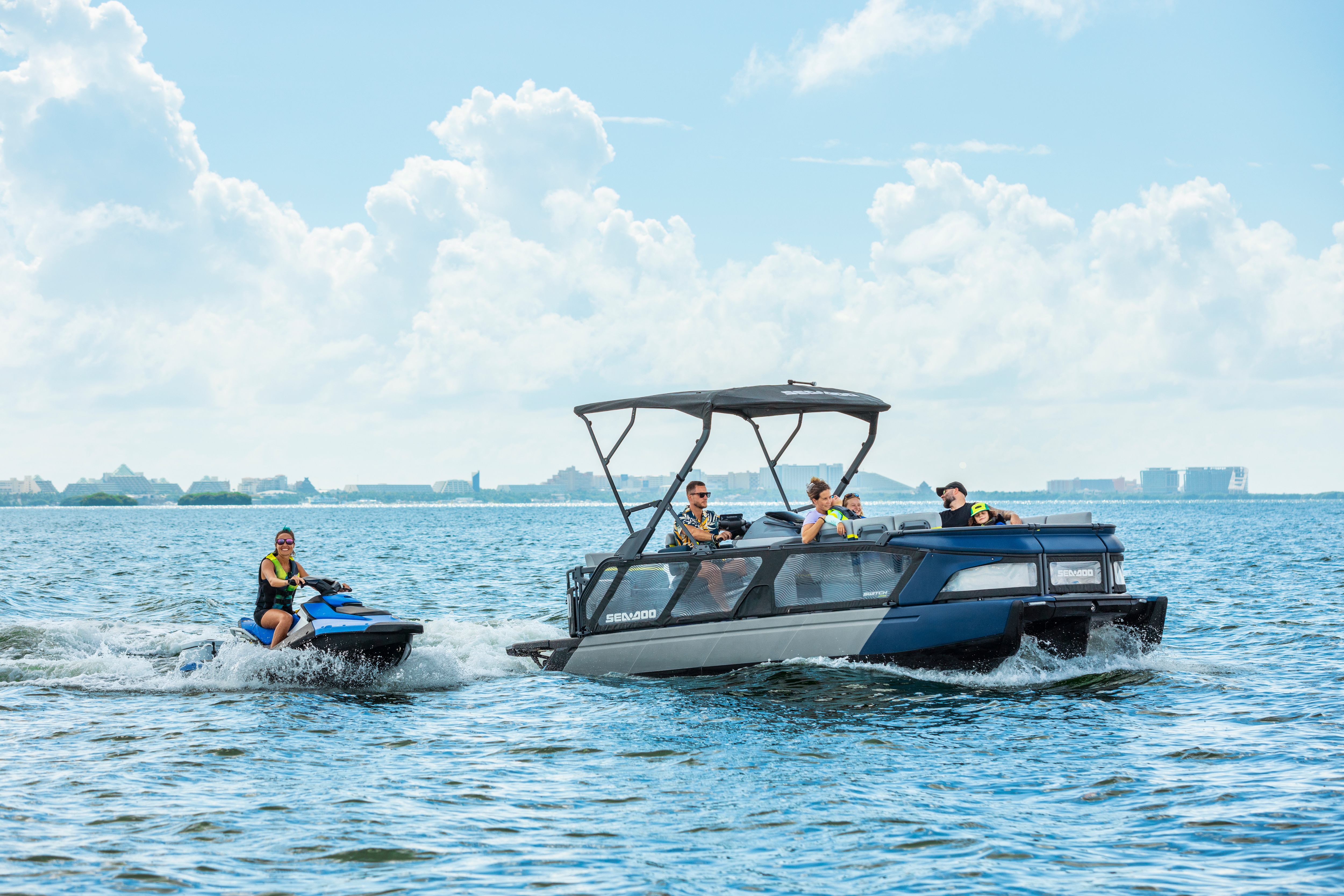 Sea-Doo personal watercraft and Switch pontoon riding side by side