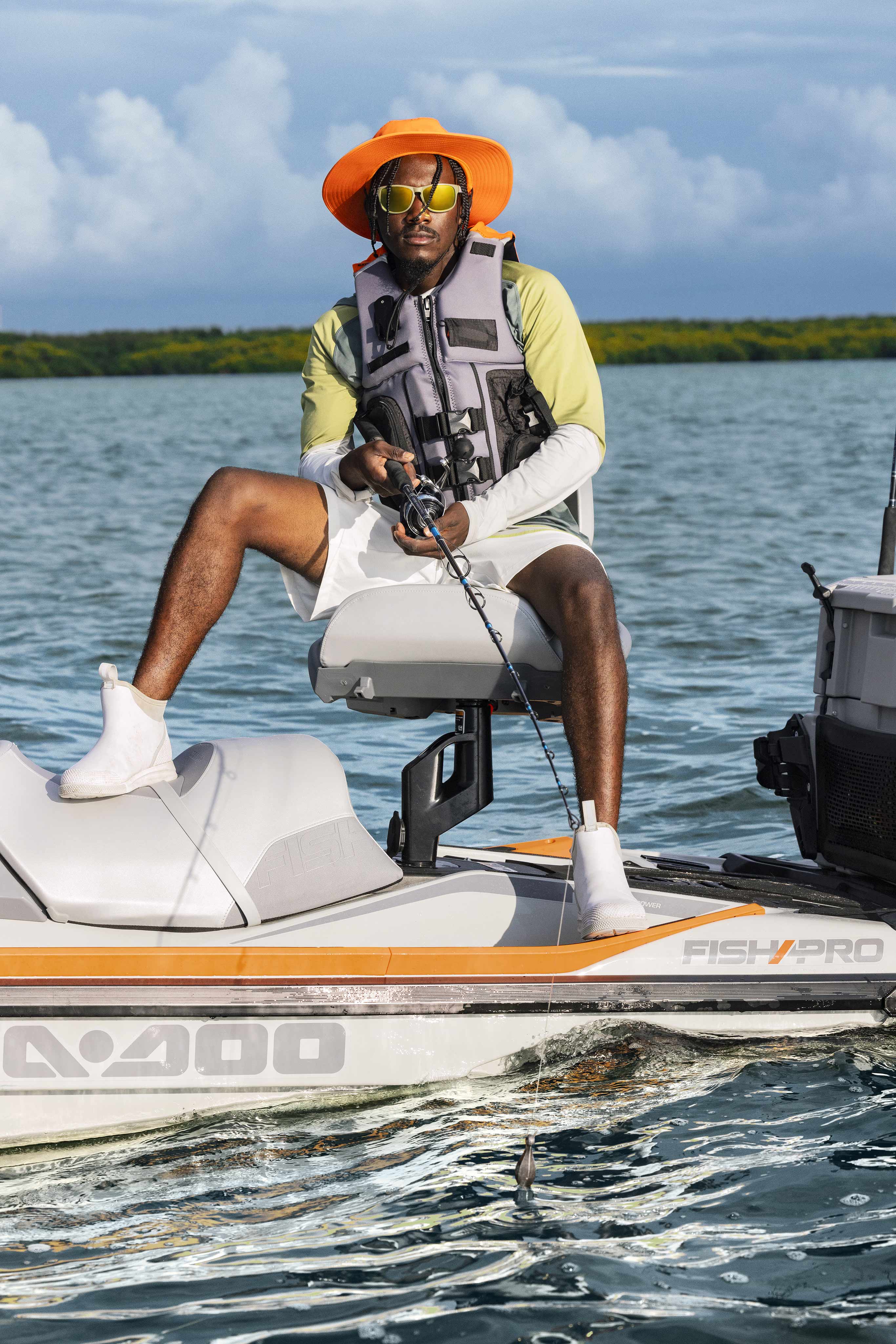 Man fishing on her Sea-Doo FishPro Trophy with the modular swivel seat