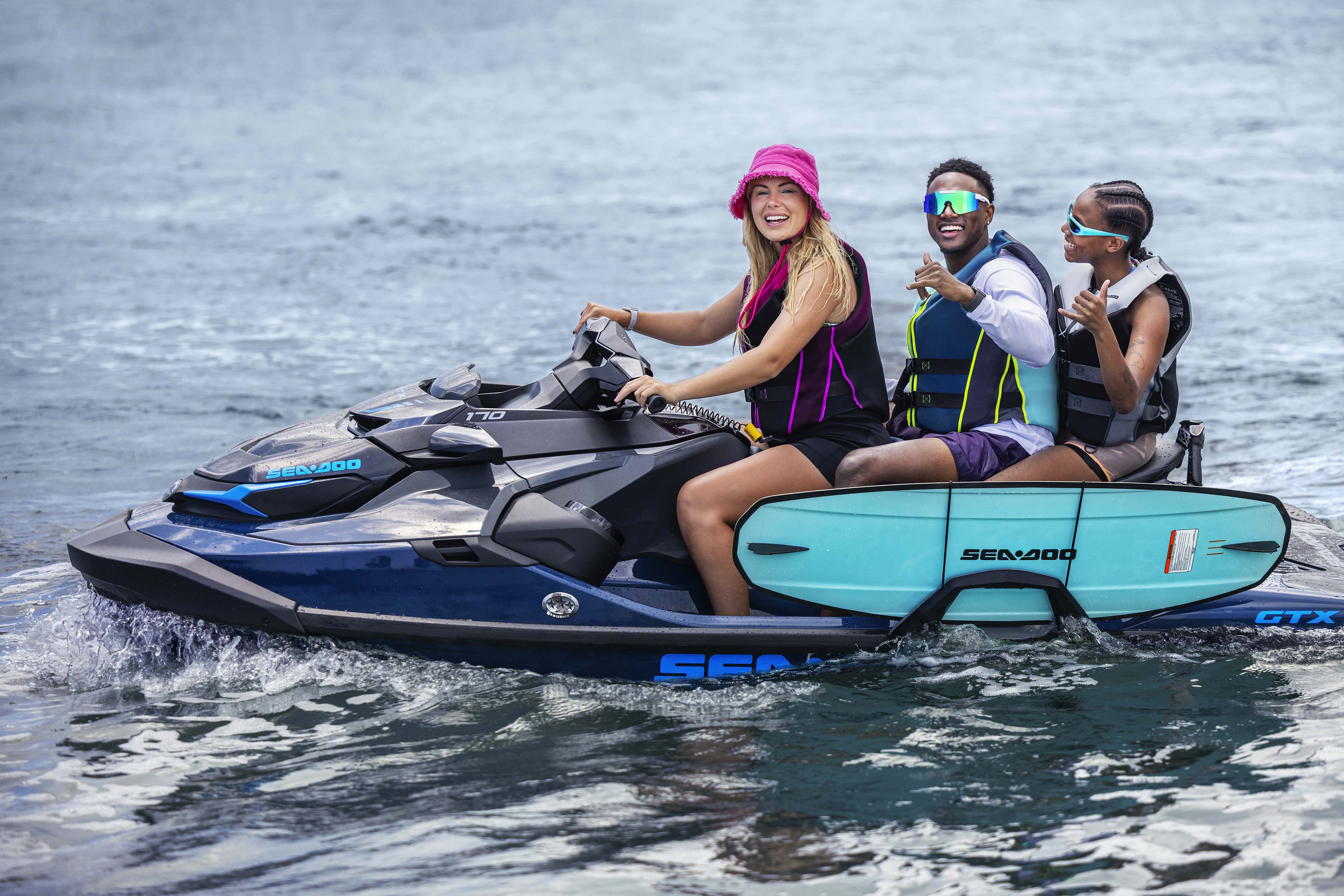 Three friends on a Sea-Doo GTX personal watercraft