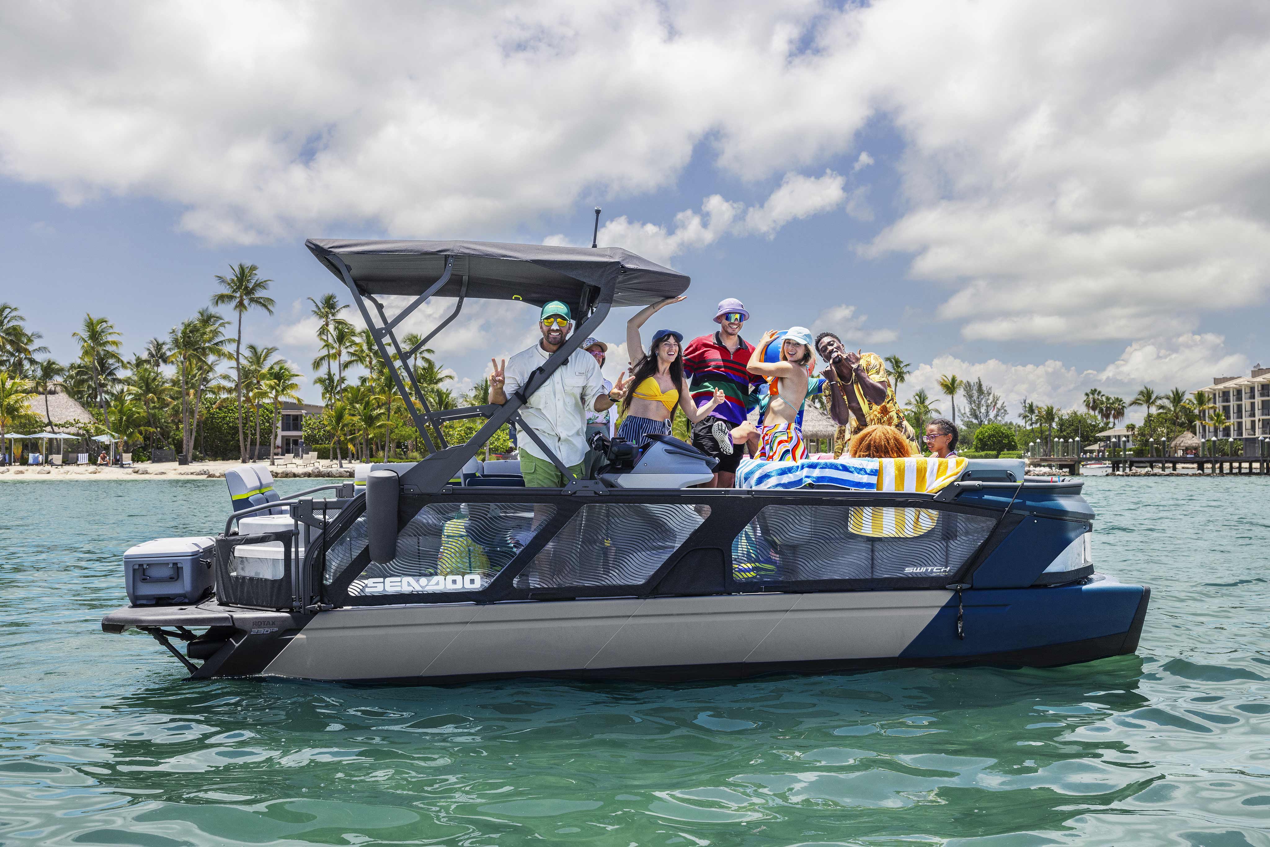 Family having fun on a 2024 Sea-Doo Switch Cruise Limited pontoon boat