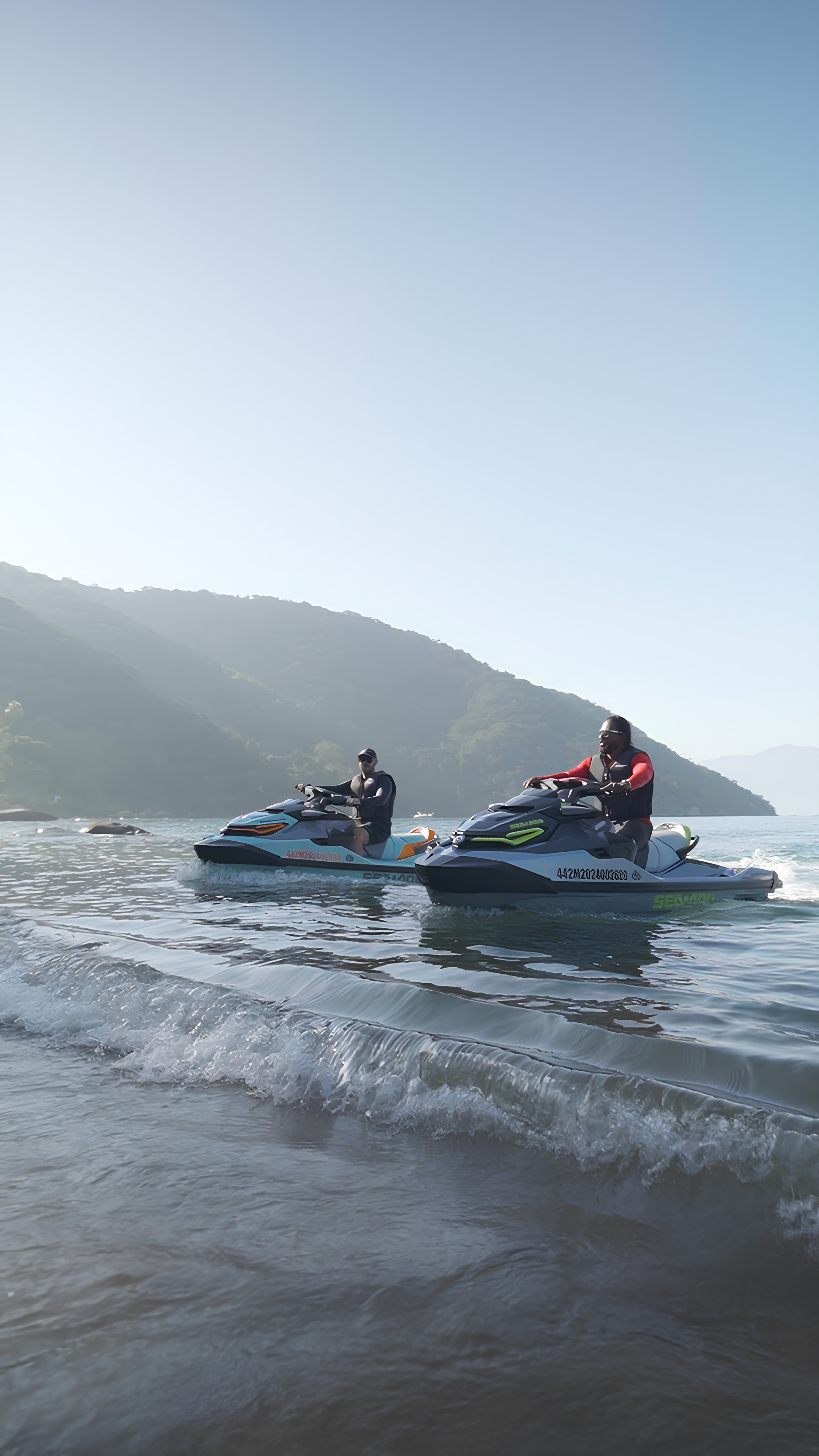 Sea-Doo ambassador Aqua Dan and another rider on their Sea-Doo personal watercraft cruise on calm water with mountains in the background.