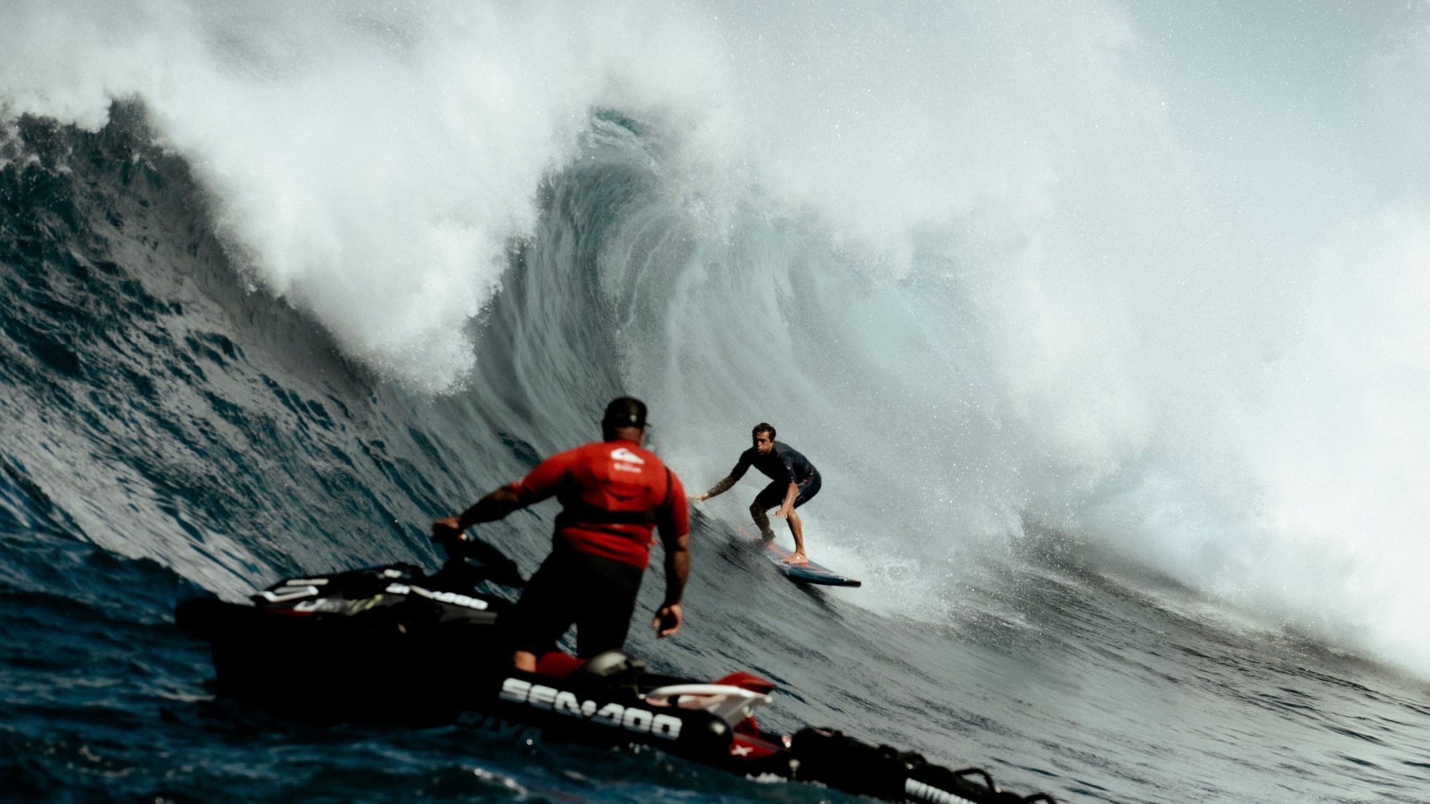 Sea-Doo ambassador riding a PWC near a surfer
