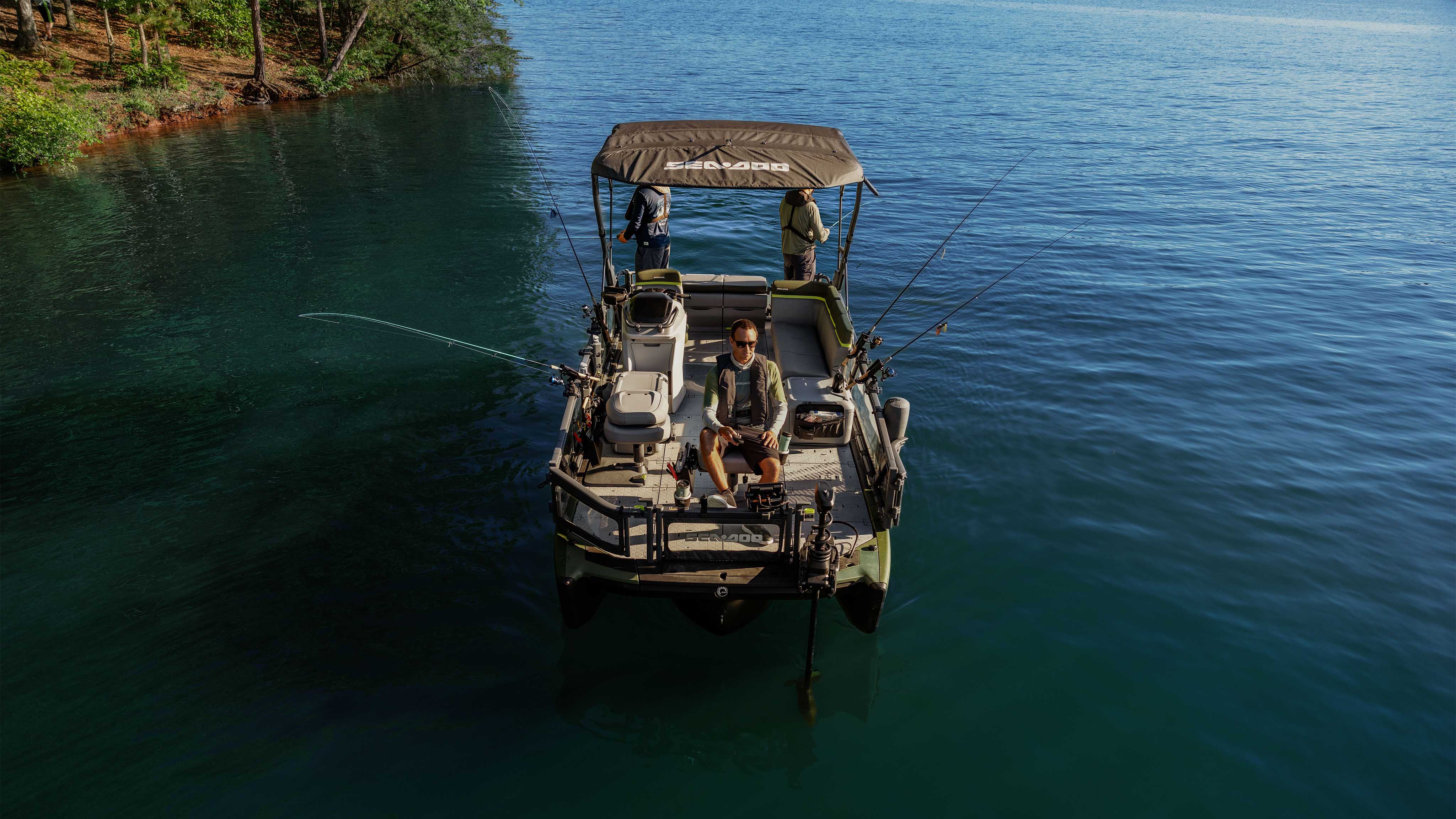 Three men fishing from the 2025 Sea-Doo Switch Fish pontoon boat