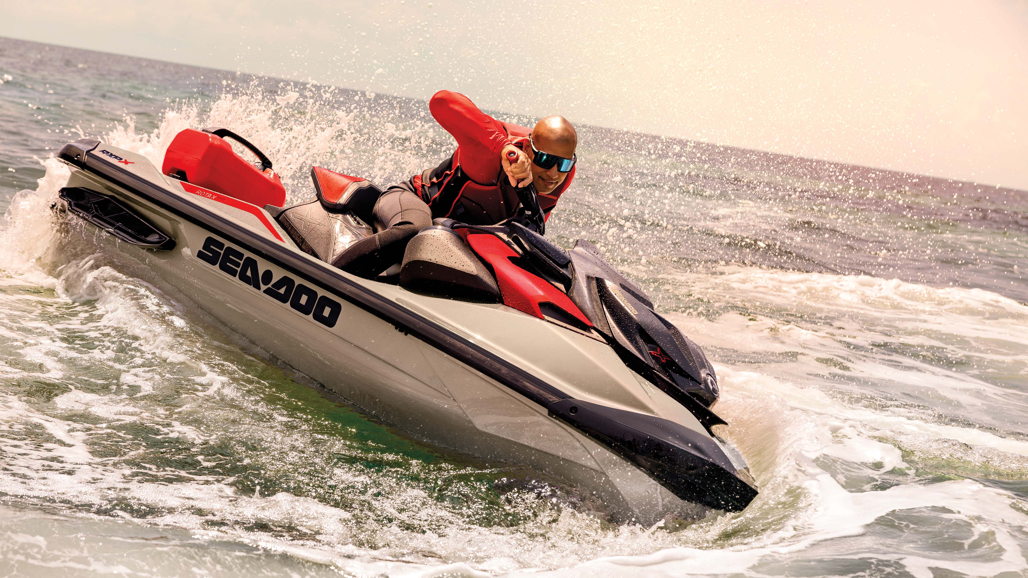 Man sitting on an idle Sea-Doo RXP-X personal watercraft