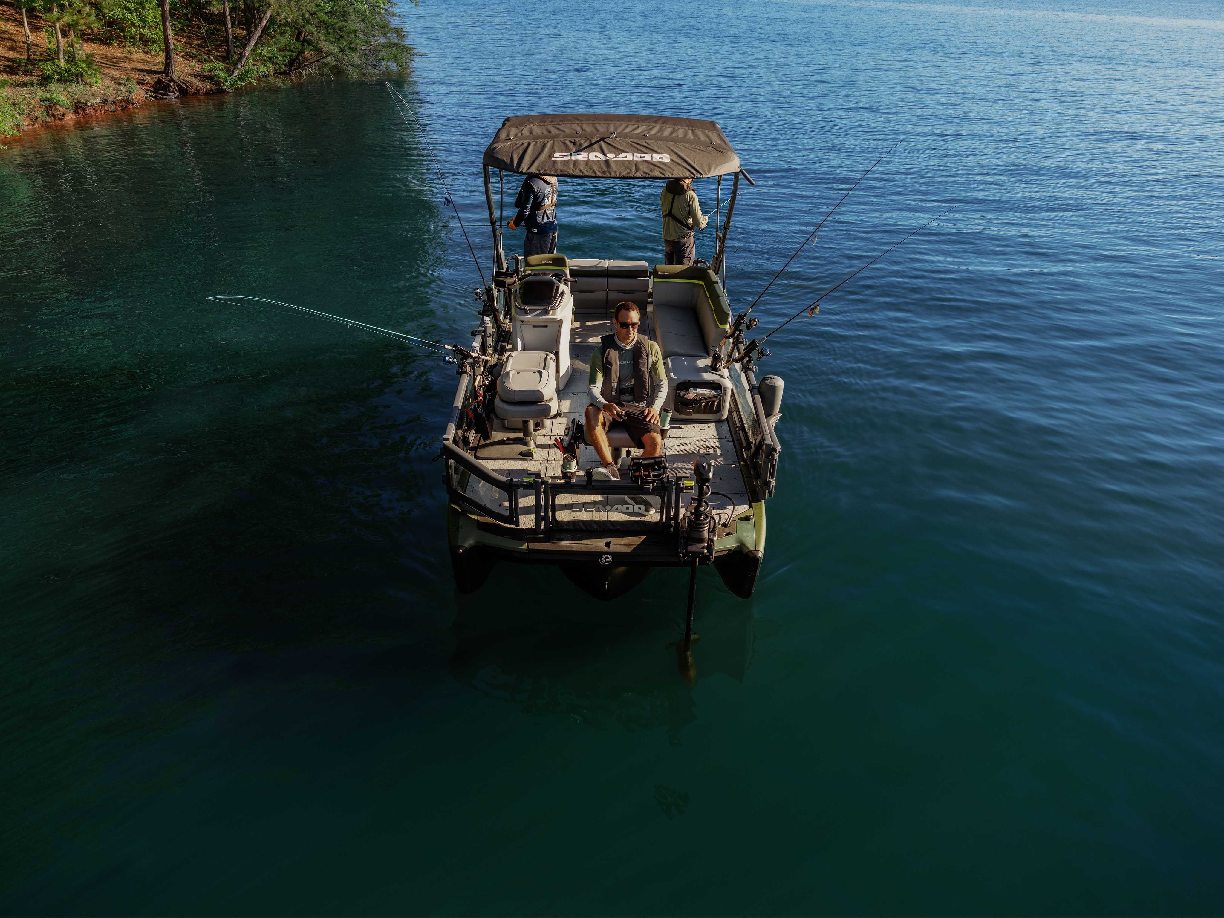 Three men fishing from the 2025 Sea-Doo Switch Fish pontoon boat