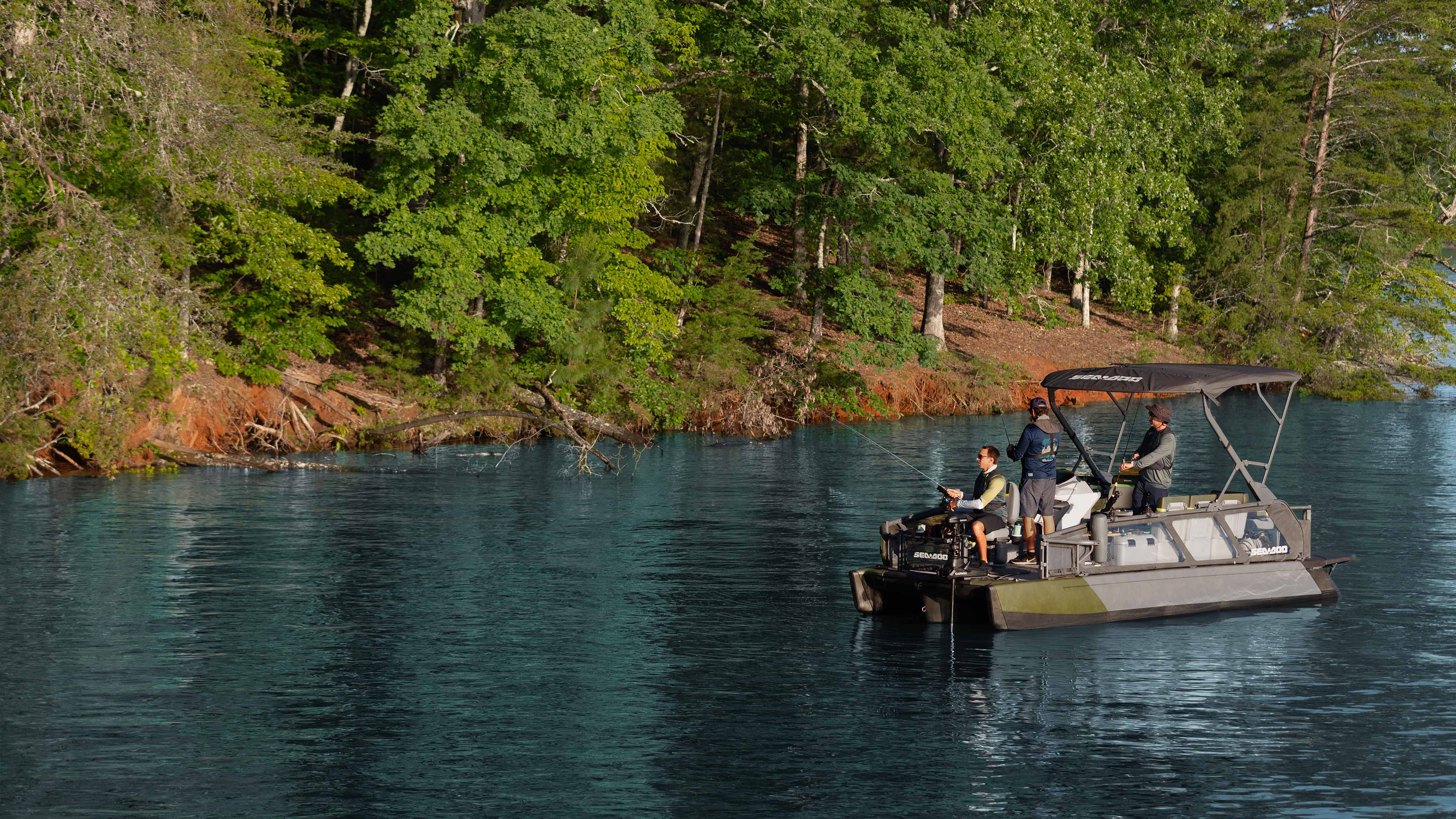 Two men riding the 2025 Sea-Doo Switch Fish pontoon boat