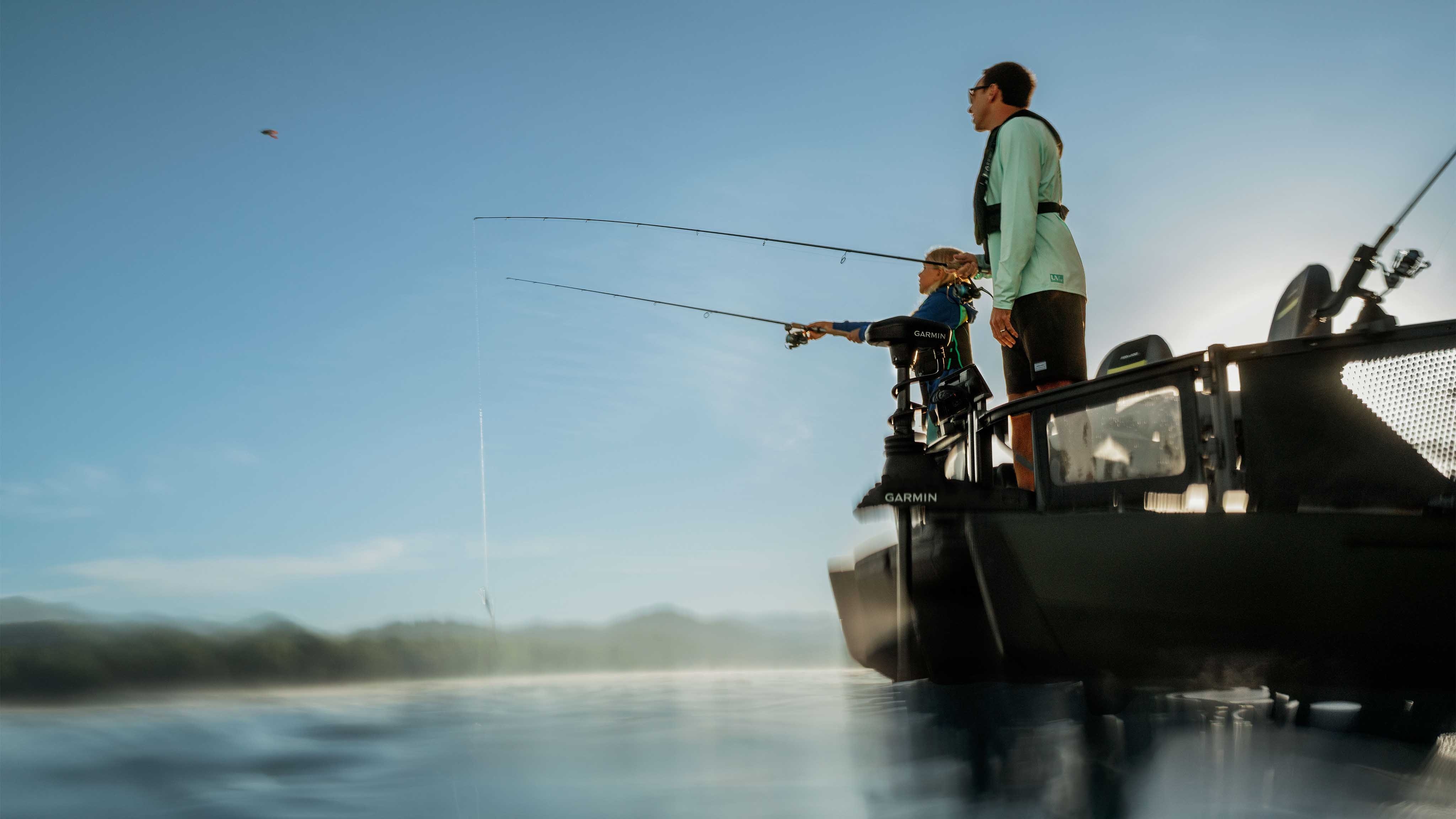 Man and women fishing from the 2025 Sea-Doo Switch Fish pontoon boat