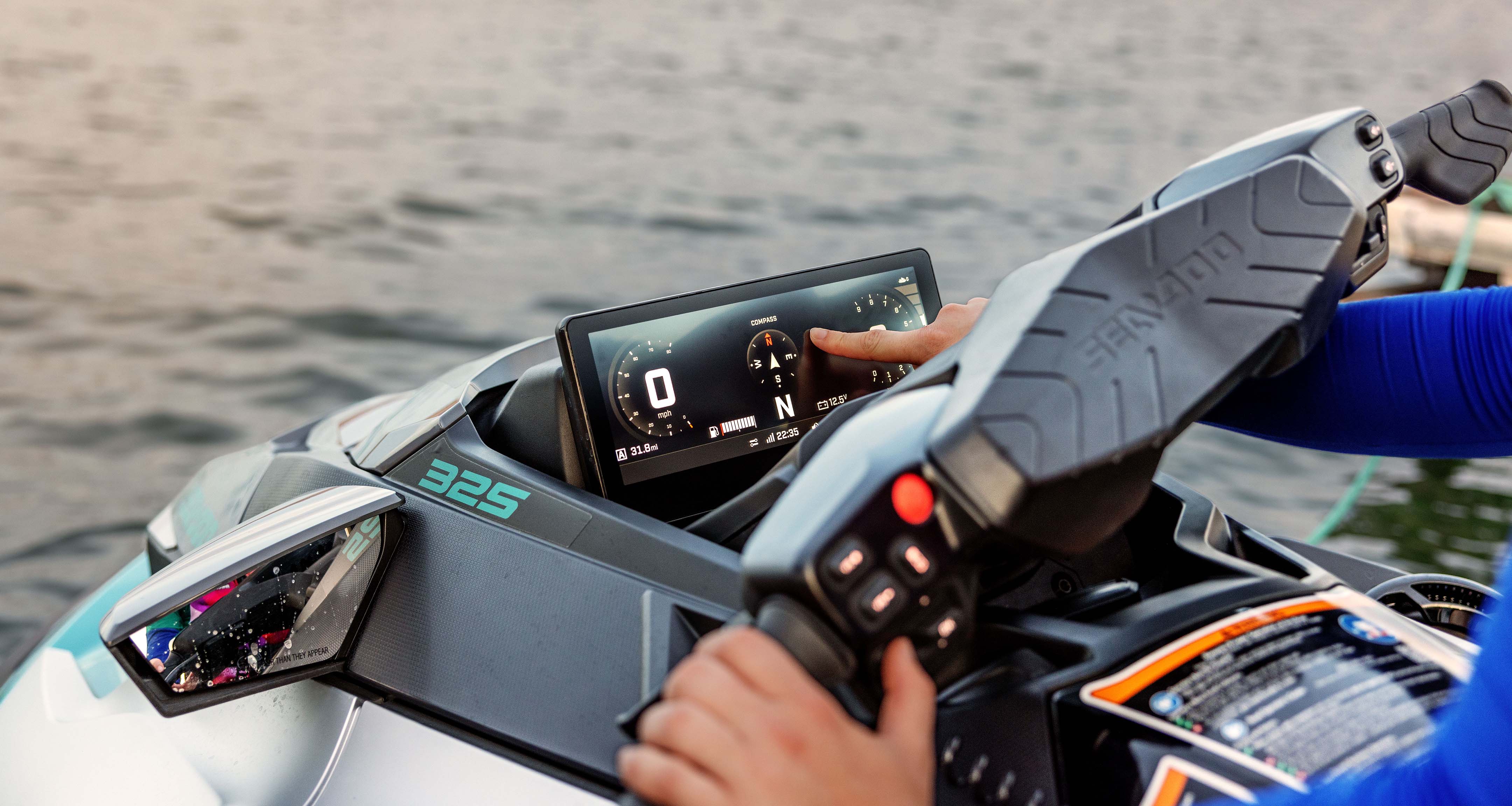 Rider using the touchscreen display on the Sea-Doo GTX Limited