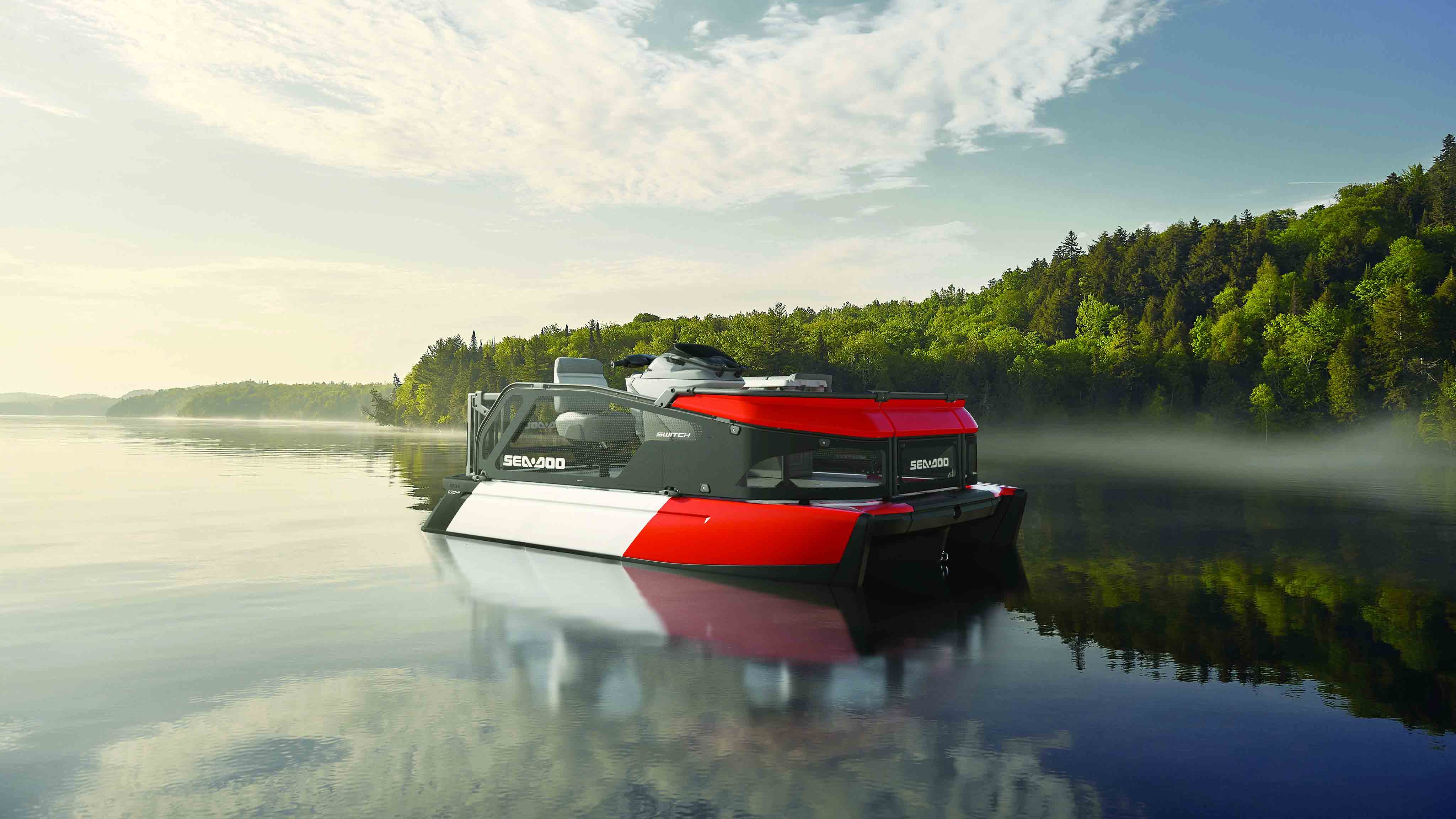A Sea-Doo Switch 2026 anchored on a lake
