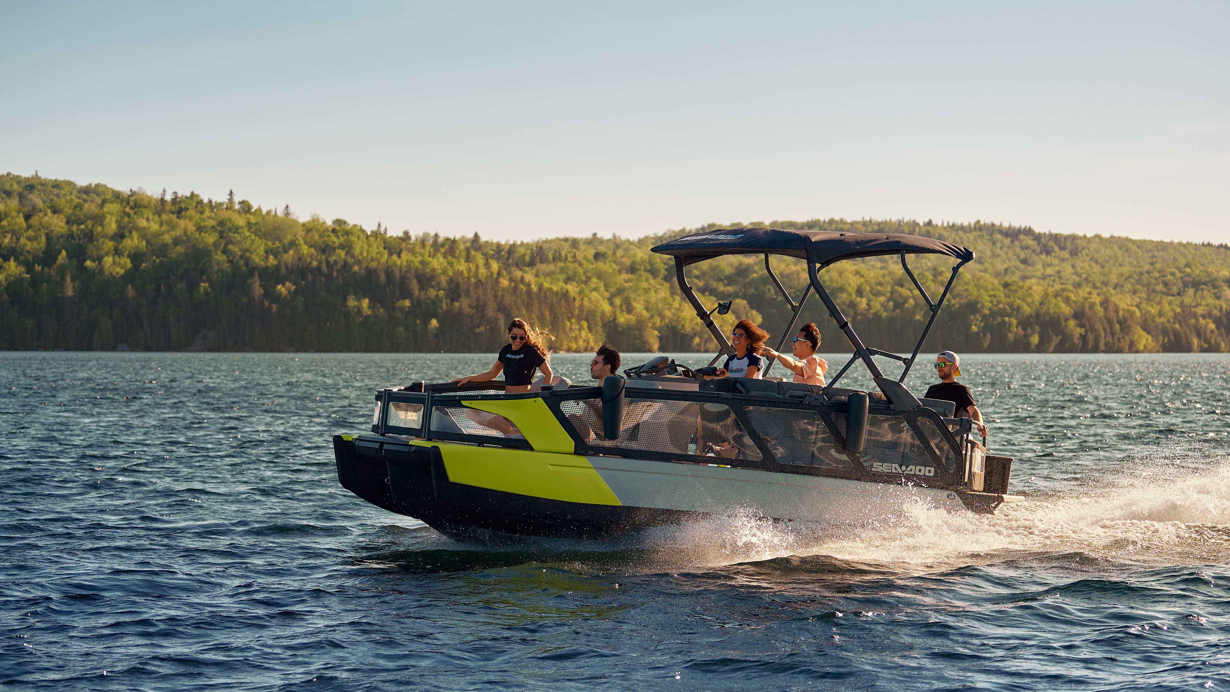 Group of friends enjoying an outing on the Sea-Doo SWITCH SPORT pontoon boat