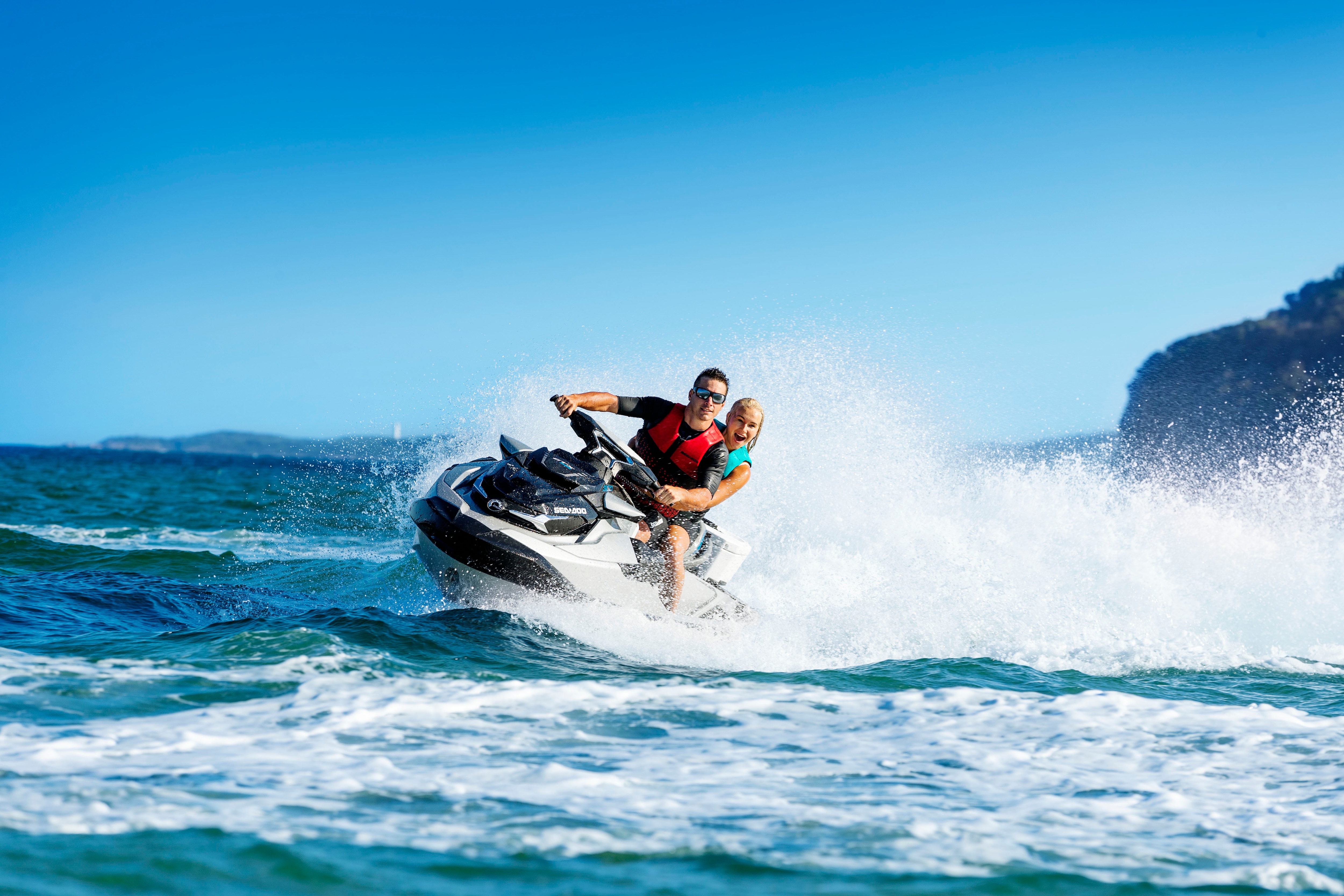 Man driving a GTI SE Sea-Doo with his girlfriend