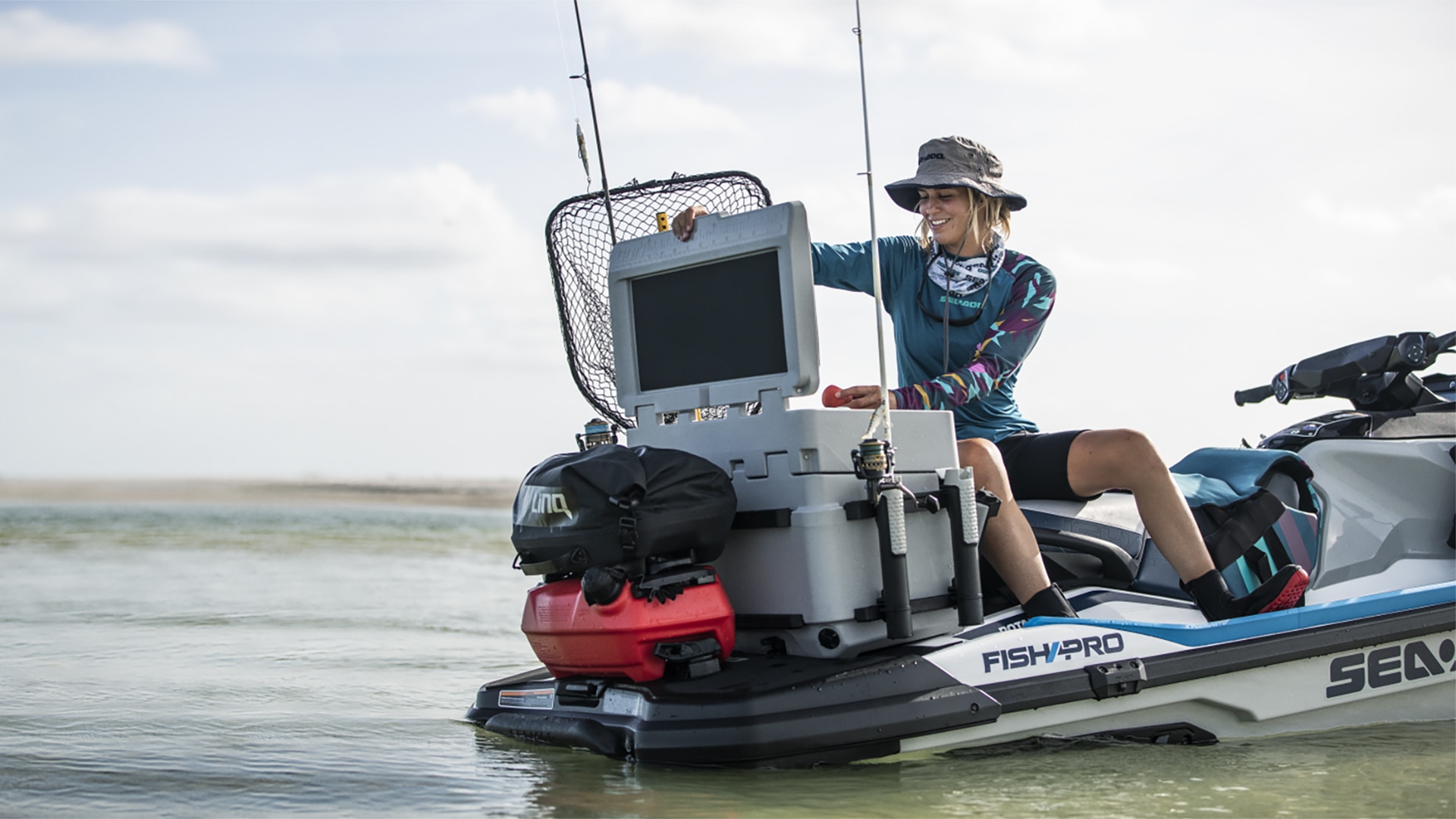 A woman on a Fish Pro opening the cooler