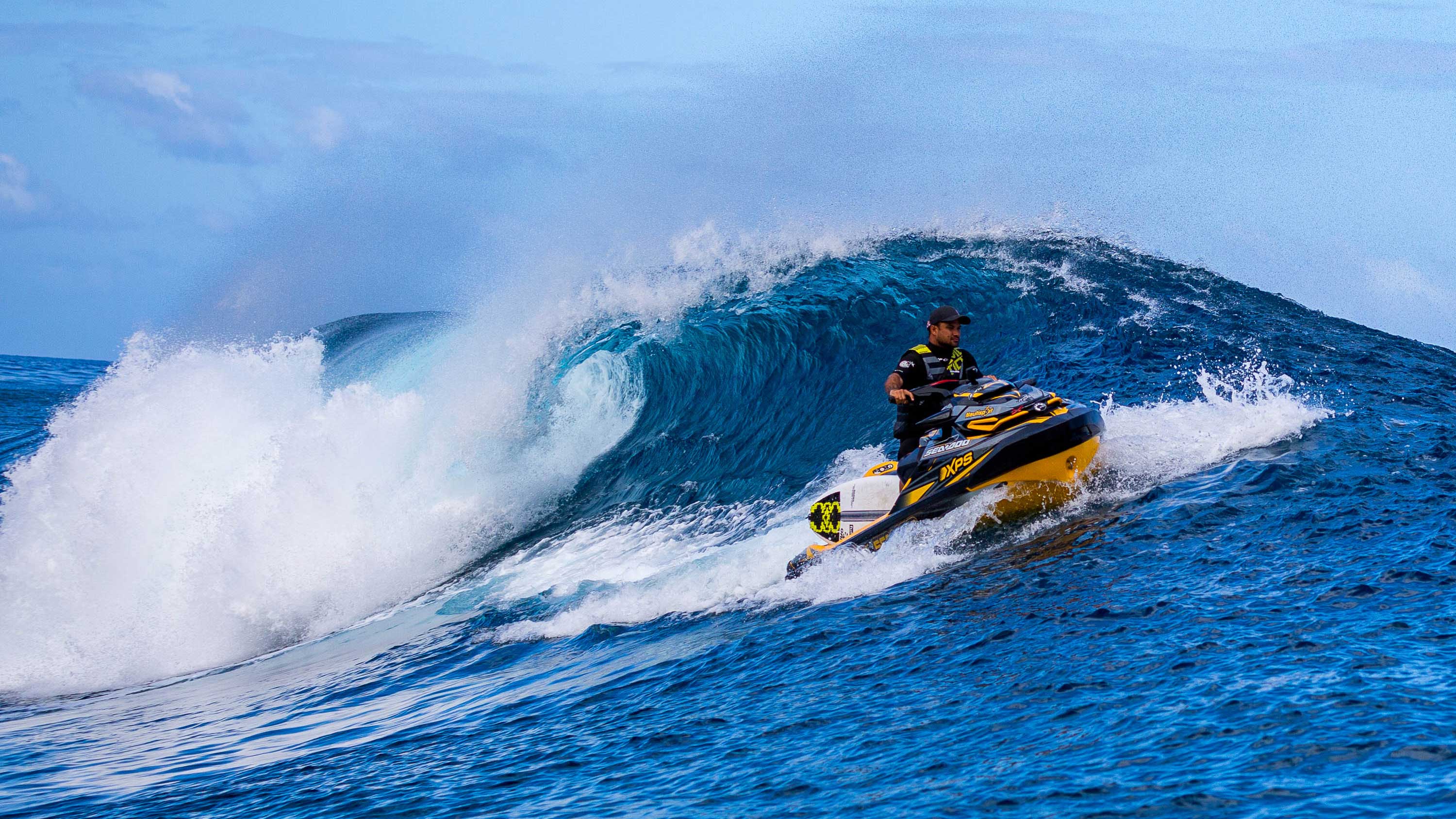 Michel Bourez on a Sea-Doo riding a wave