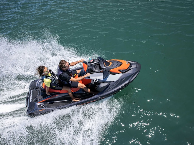 Couple riding a Sea-Doo GTI personal watercraft