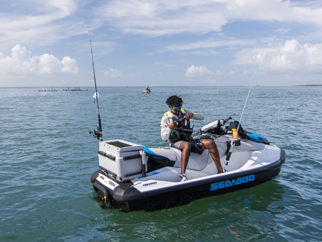 Man fishing on his Sea-Doo FishPro Scout