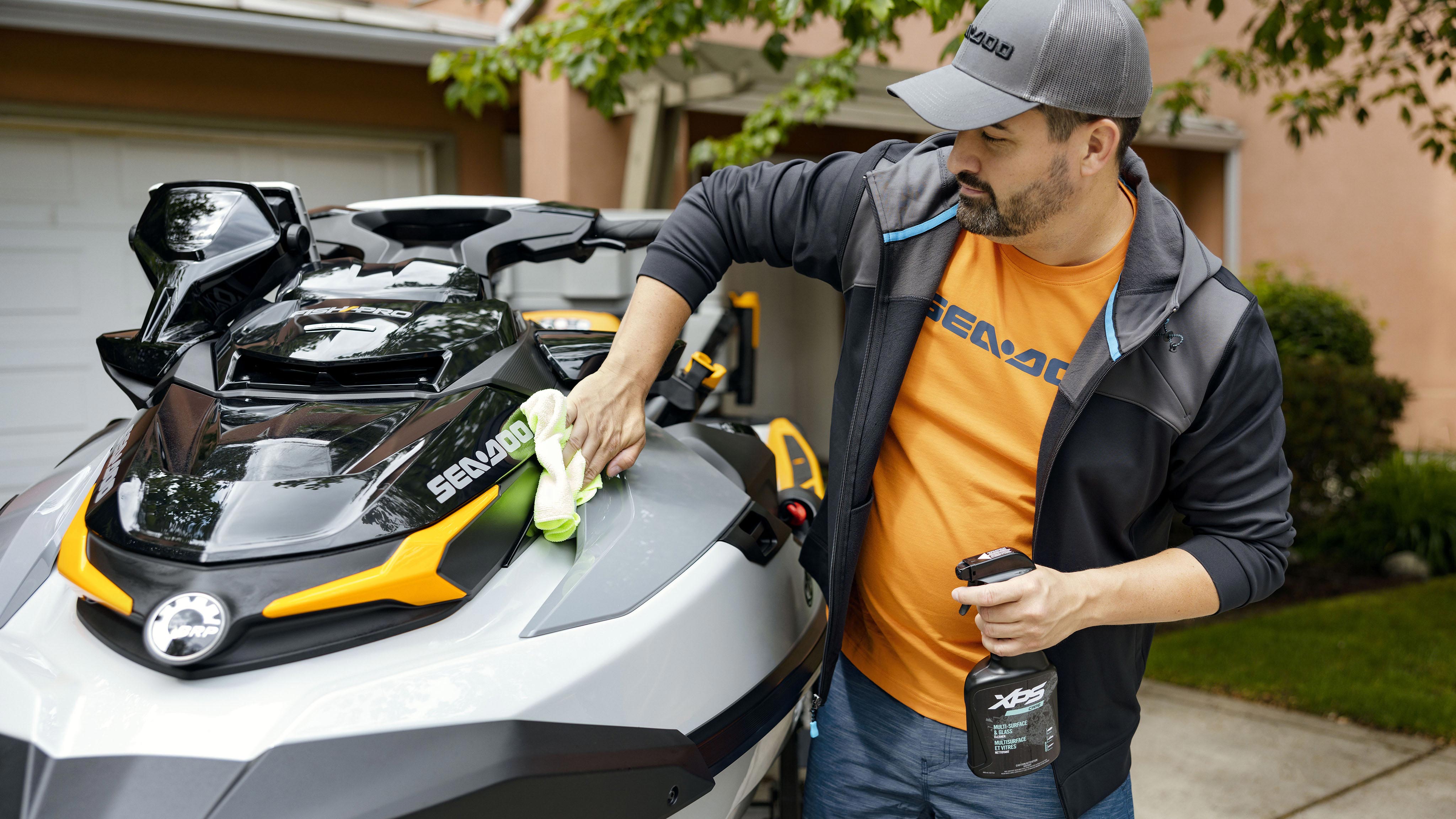 Man washing his Sea-Doo watercraft with XPS care products