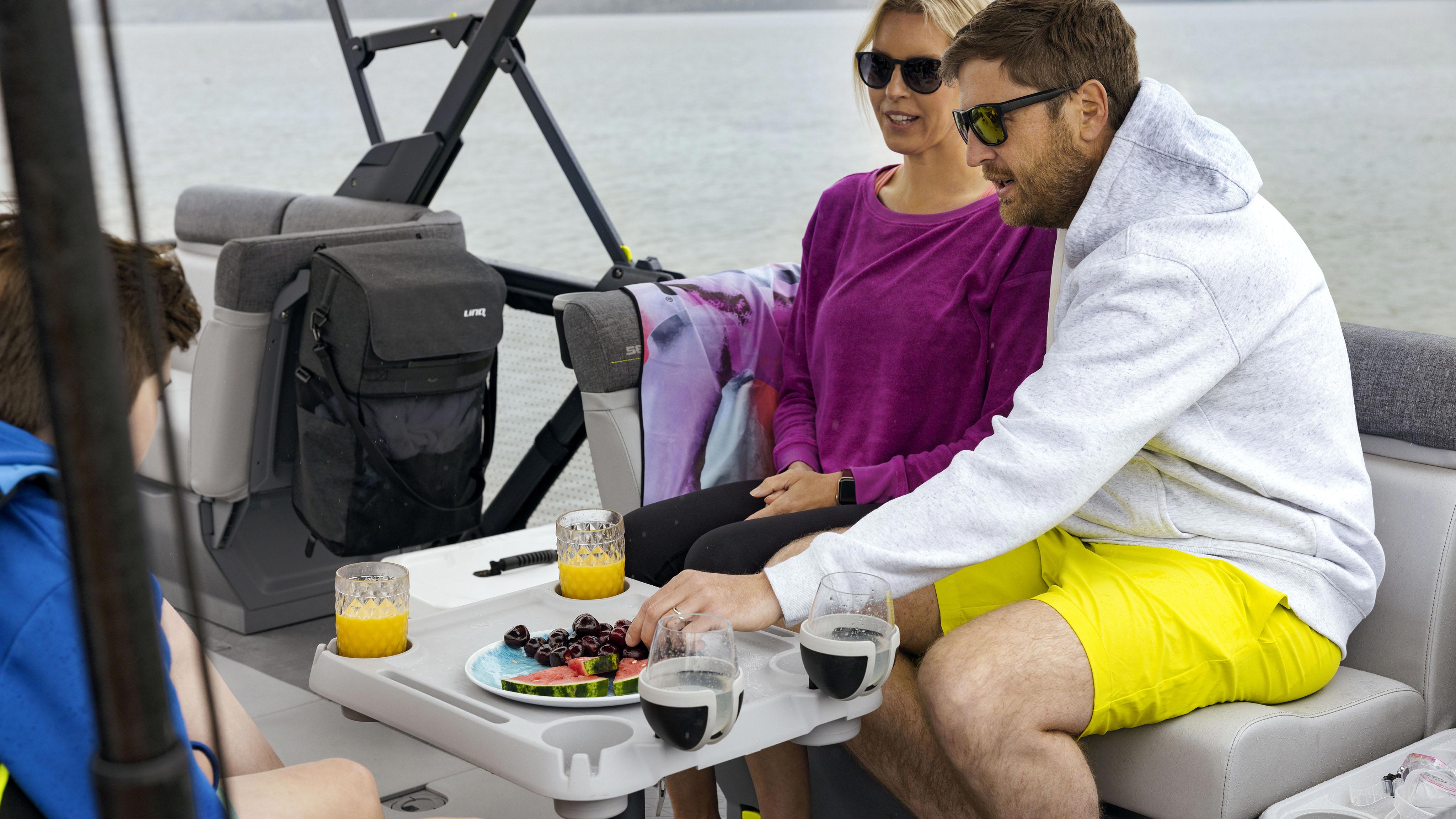 Family enjoying a meal on the Sea-Doo SWITCH CRUISE