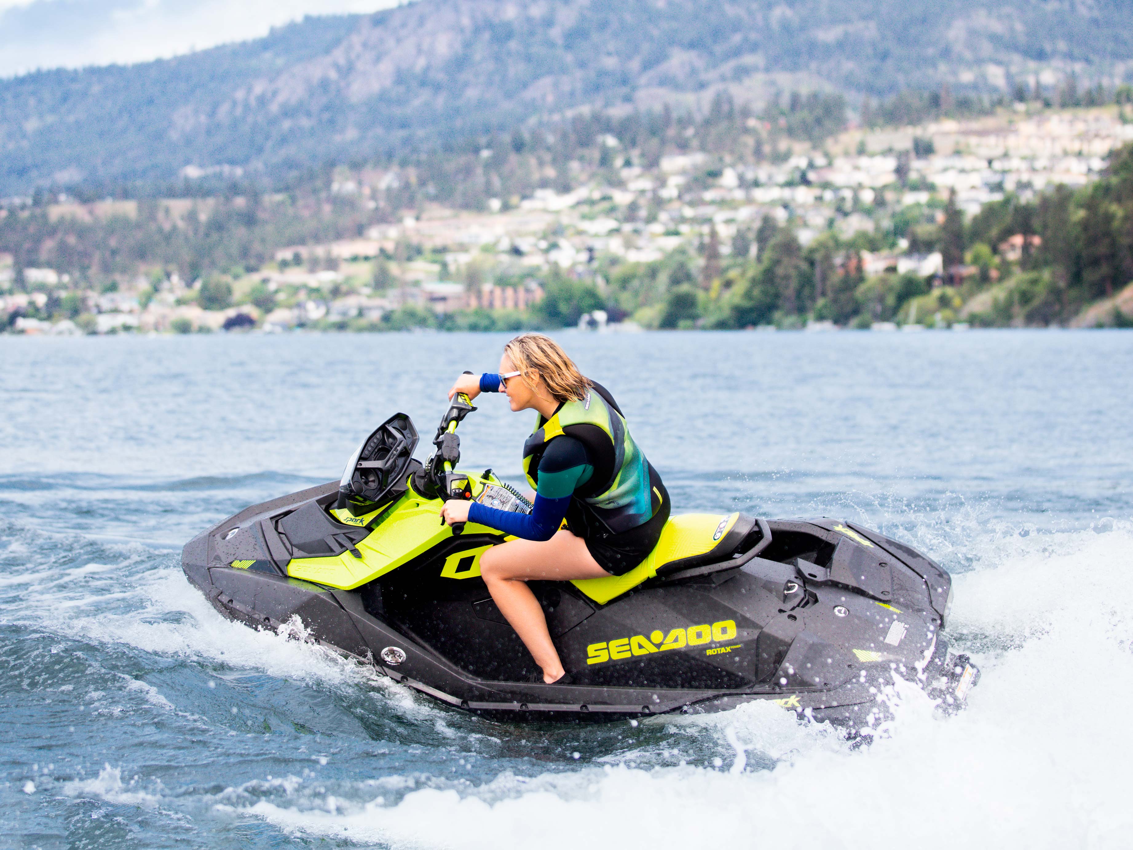 Woman riding the Sea-Doo Spark Trixx with the Audio-Portable system