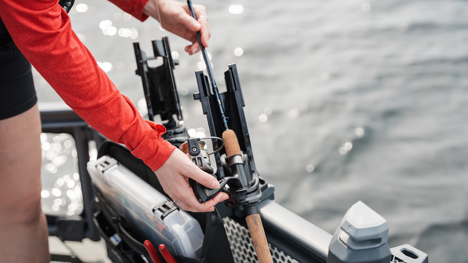 A fishing rod placed on the Sea-Doo Switch pontoon rod holder