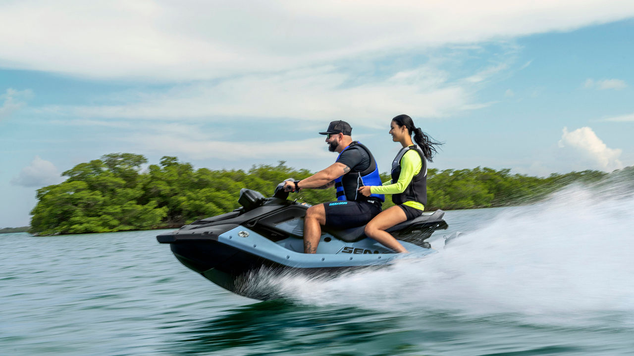 A man and a woman on the new Sea-Doo Spark X personal watercraft with a 110-hp engine
