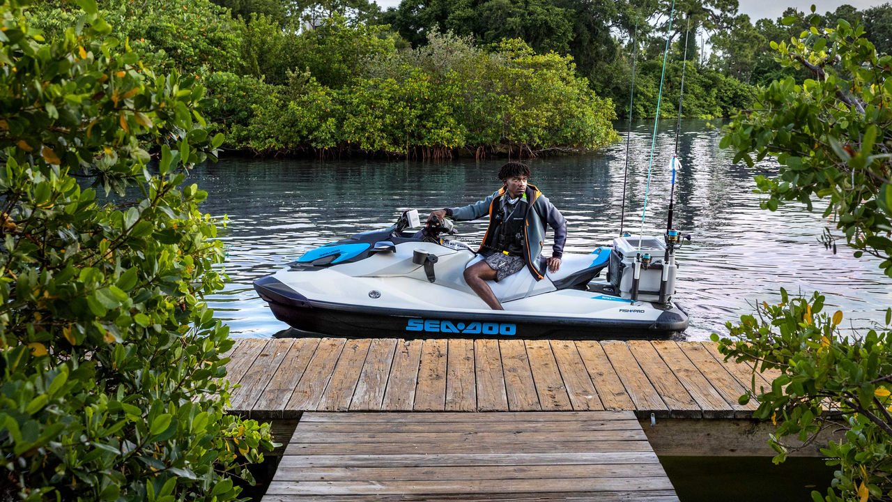 A man docking his Sea-Doo FishPro personal watercraft