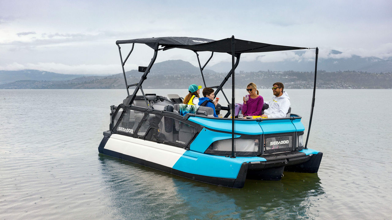 Family enjoying a meal on the Sea-Doo Switch Cruise