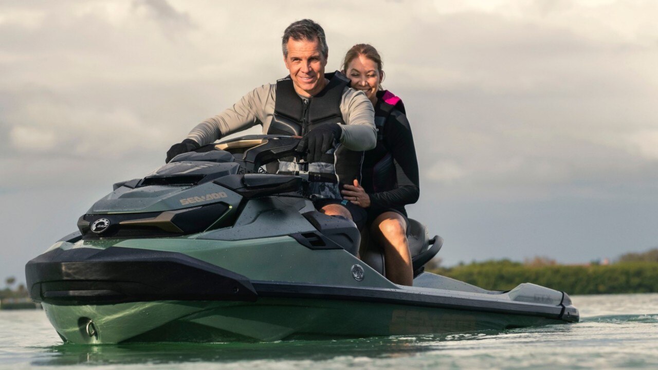 Couple riding a Sea-Doo GTX Limited
