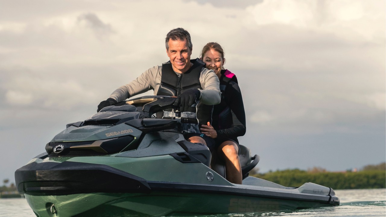 Couple riding a Sea-Doo GTX Limited