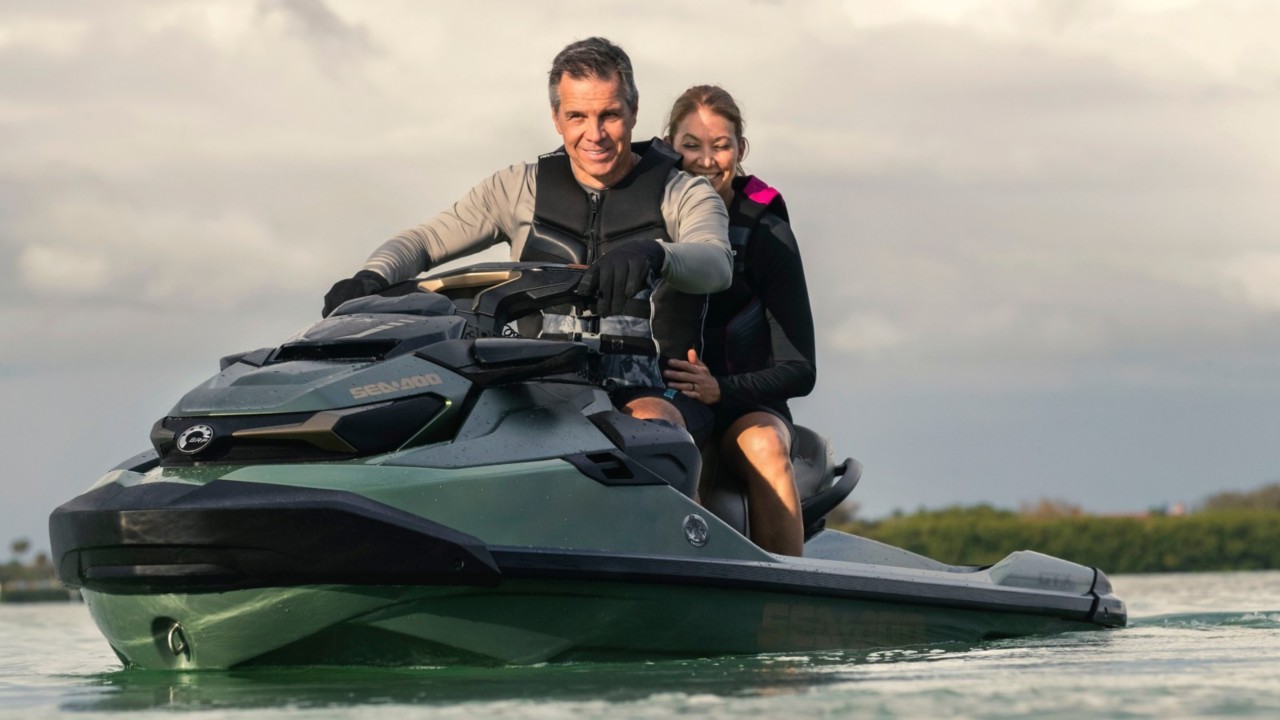 Couple riding a Sea-Doo GTX Limited